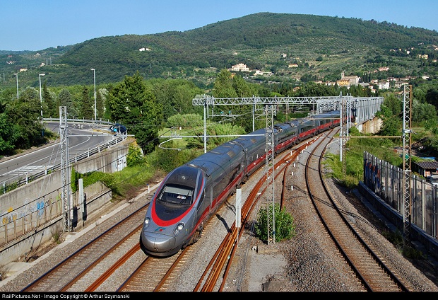 Train traveling past the Arno Ticketless and PNR Codes on Trenitalia
